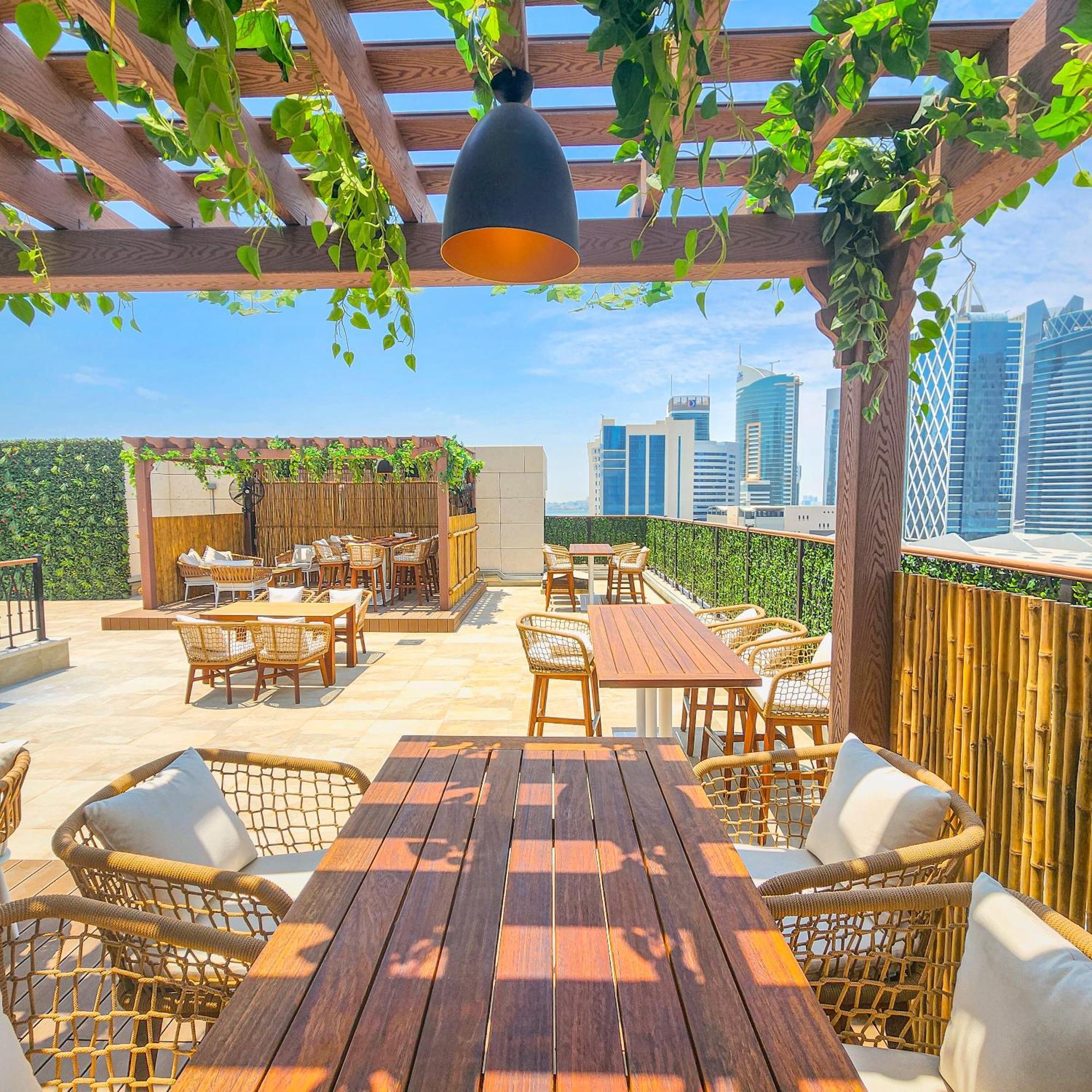 City Centre Rotana Doha Bagian luar foto The rooftop bar at the hotel