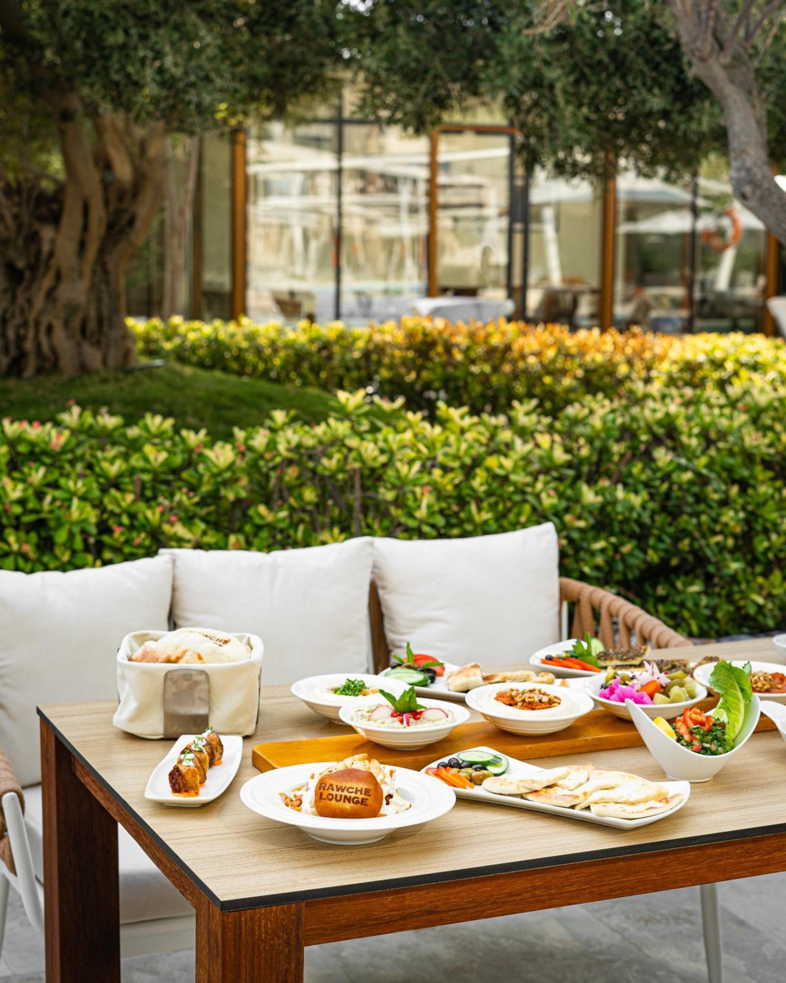 City Centre Rotana Doha Bagian luar foto A selection of dishes at the restaurant