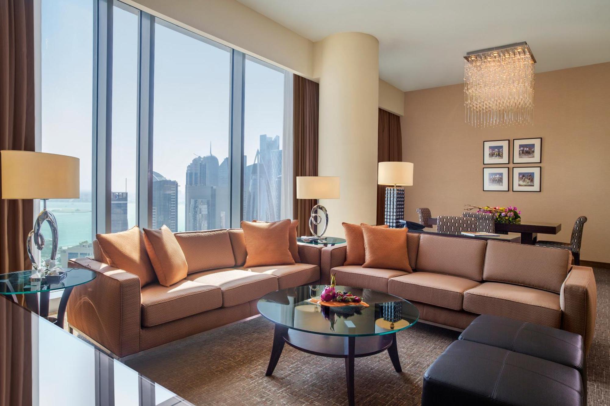 City Centre Rotana Doha Bagian luar foto A living room in a suite at the Ritz-Carlton, DIFC